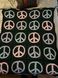 a blanket with peace signs on it